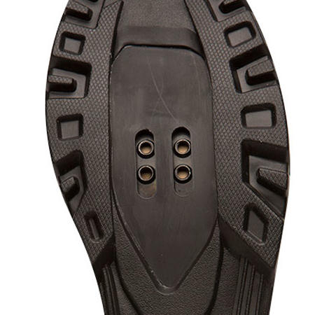 The cleat mounting area on the sole of a mountain biking shoe