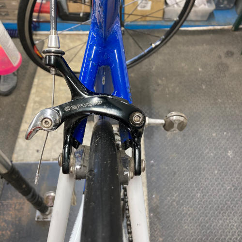 Road bicycle showing tire clearance at the rear brake and seatstays
